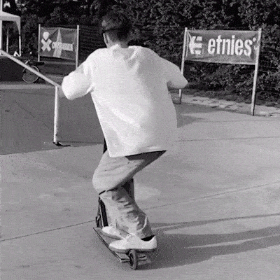 Kristian Dimitrov from jwax scooter team slides up a rail at a skatepark